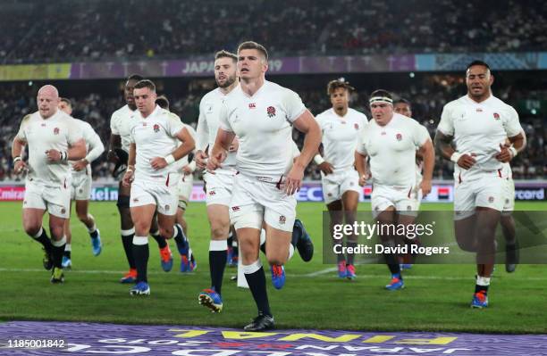 Owen Farrell of England leads his players off the pitch for the half time break during the Rugby World Cup 2019 Final between England and South...