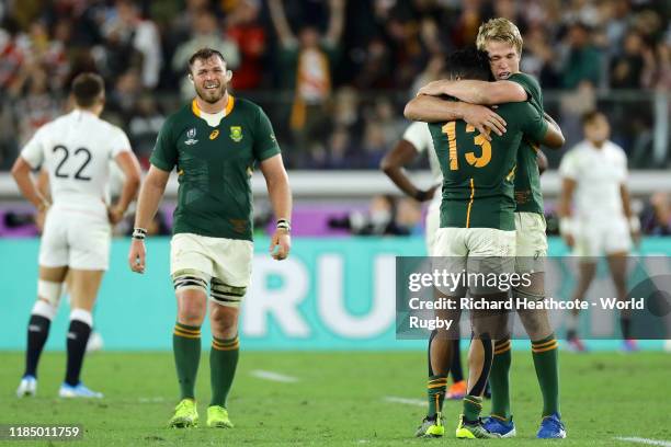 Lukhanyo Am of South Africa celebrates with teammate Pieter-Steph du Toit after their team's victory against England during the Rugby World Cup 2019...