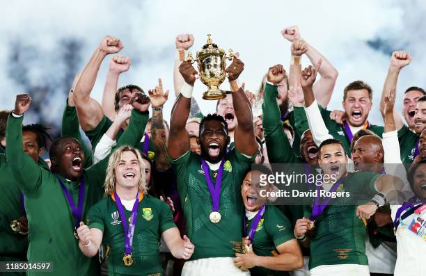 Siya Kolisi of South Africa lifts the Web Ellis cup following his team's victory against England in the Rugby World Cup 2019 Final between England...