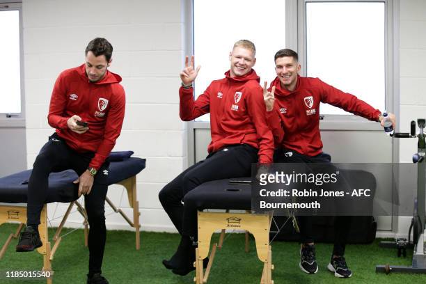 Adam Smith, Aaron Ramsdale and Chris Mepham keep an eye on the Rugby World Cup Finalof Bournemouth in the home dressing room before the Premier...