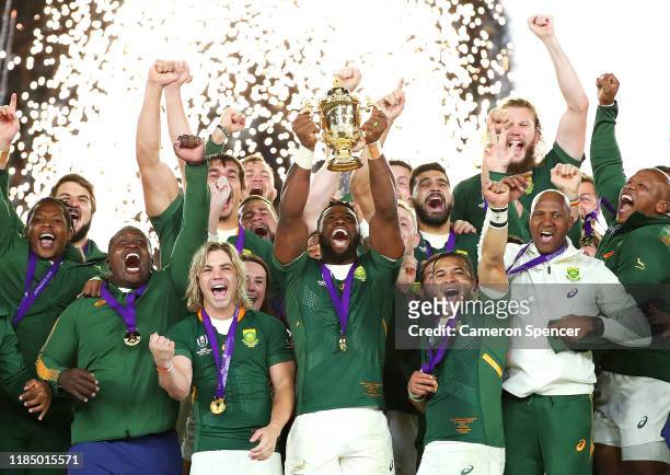 Pyrotechnics explode as Siya Kolisi of South Africa lifts the Webb Ellis Cup following his team's victory against England in the Rugby World Cup 2019...