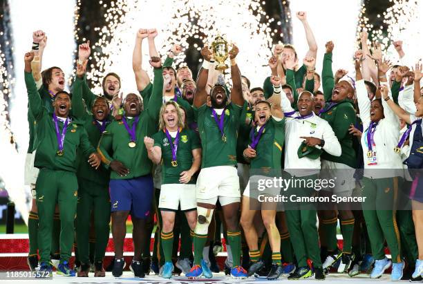 Pyrotechnics explode as Siya Kolisi of South Africa lifts the Webb Ellis Cup following his team's victory against England in the Rugby World Cup 2019...