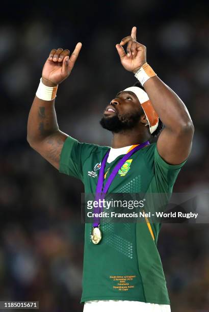 Siya Kolisi of South Africa points to the sky after collecting his winners medal following his team's victory against England in the Rugby World Cup...