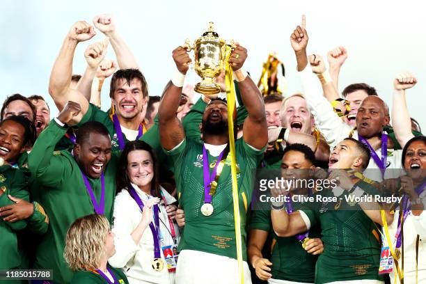 Siya Kolisi of South Africa lifts the Webb Ellis Cup following his team's victory against England in the Rugby World Cup 2019 Final between England...