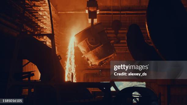 steel mill factory - molten metal in vat - foundry stock pictures, royalty-free photos & images