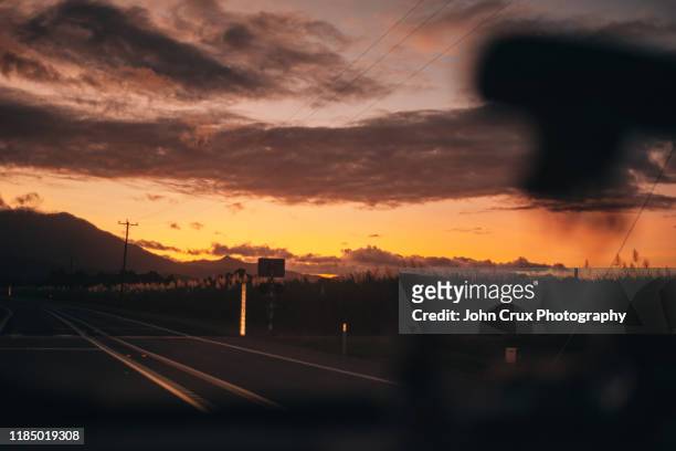 sunset road trip - cairns road stock pictures, royalty-free photos & images