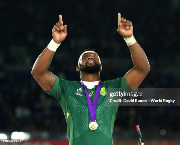 Siya Kolisi of South Africa points to the sky after collecting his winners medal following his team's victory against England in the Rugby World Cup...