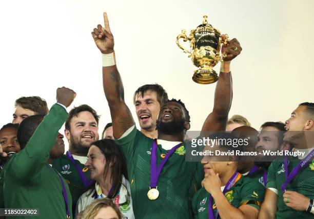 Siya Kolisi of South Africa points to the sky as he lifts the Web Ellis cup following his team's victory against England in the Rugby World Cup 2019...