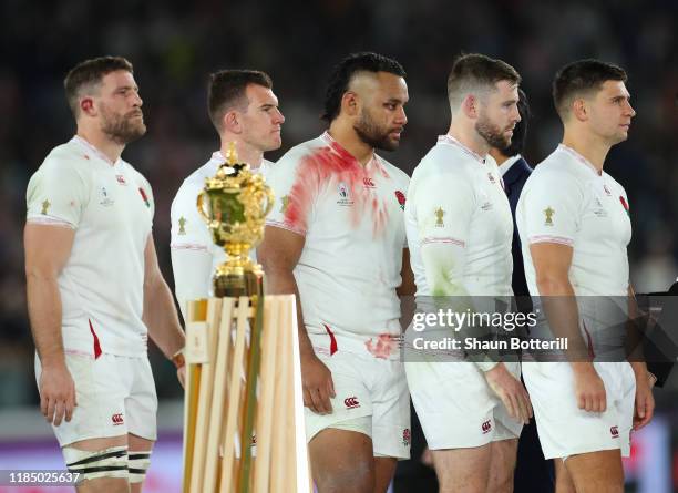 England players Ben Youngs, Elliot Daly, Billy Vunipola, Ben Spencer and Mark Wilson walk past the Webb Ellis Trophy after the Rugby World Cup 2019...