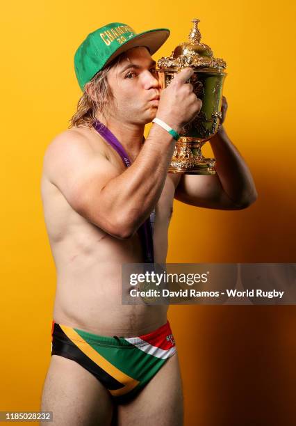 Faf de Klerk of South Africa poses for a portrait with the Web Ellis Cup following his team's victory against England in the Rugby World Cup 2019...