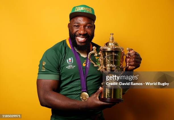Tendai Mtawarira of South Africa poses for a portrait with the Web Ellis Cup following his team's victory against England in the Rugby World Cup 2019...
