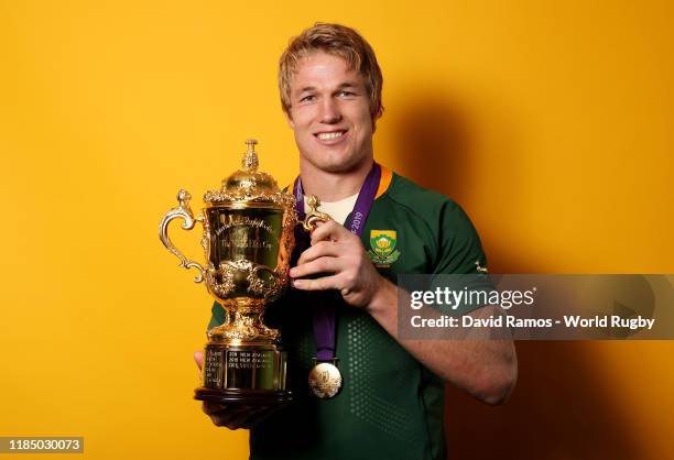 Pieter-Steph du Toit of South Africa poses for a portrait with the Web Ellis Cup following his team's victory against England in the Rugby World Cup...