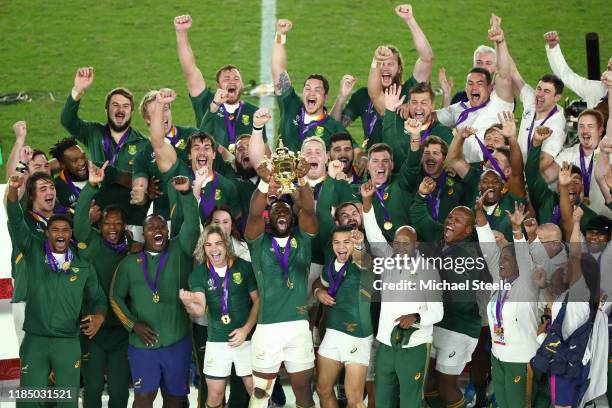 Siya Kolisi the captain of South Africa lifts the Webb Ellis trophy following his sides 32-12 victory during the Rugby World Cup 2019 Final between...