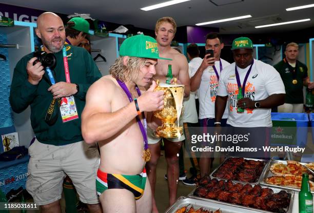 Faf de Klerk of South Africa drinks from the Webb Ellis Cup as he celebrates victory following the Rugby World Cup 2019 Final between England and...