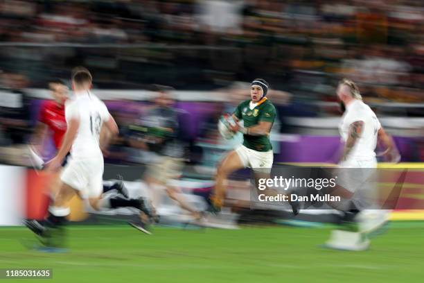 Cheslin Kolbe of South Africa makes a break during the Rugby World Cup 2019 Final between England and South Africa at the International Stadium...