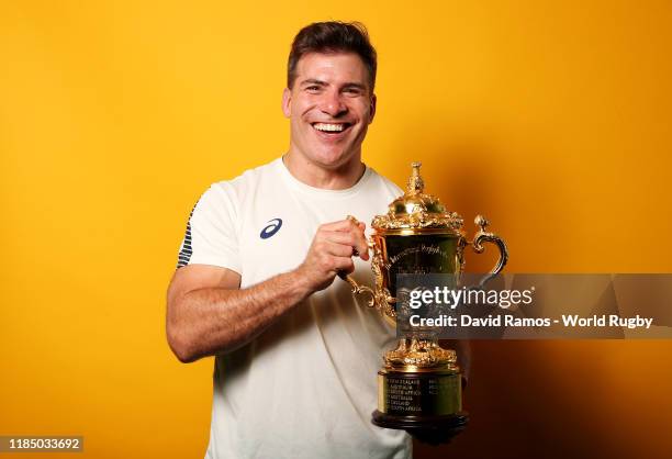 Schalk Brits of South Africa poses for a portrait with the Web Ellis Cup following his team's victory against England in the Rugby World Cup 2019...