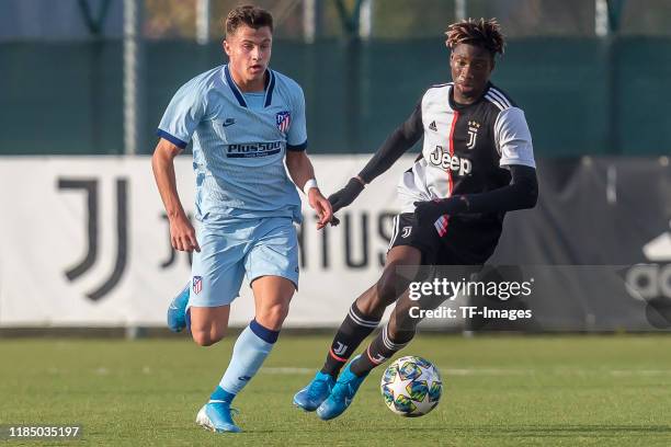 German Valera of Atletico Madrid and Mamadou Kaly Sene of Juventus U19 battle for the ball during the UEFA Youth League match between Juventus U19...