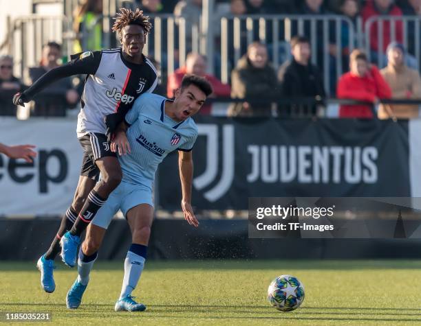 Mamadou Kaly Sene of Juventus U19 and Oscar Castro of Atletico Madrid battle for the ball during the UEFA Youth League match between Juventus U19 and...