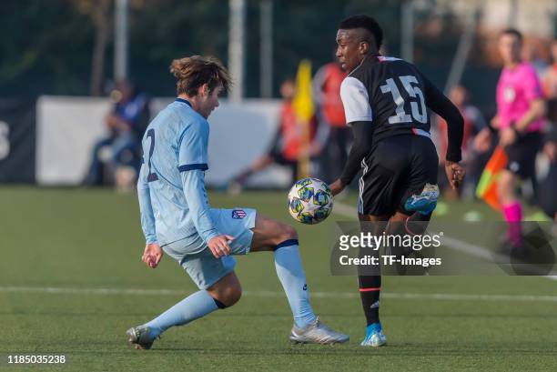 Javier Ajenjo of Atletico Madrid and Franco Tongya of Juventus U19 battle for the ball during the UEFA Youth League match between Juventus U19 and...