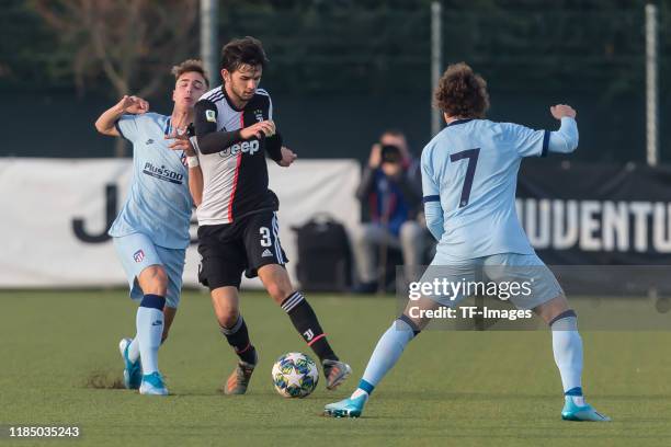 Javier Ajenjo of Atletico Madrid, Matteo Anzolin of Juventus U19 and Rodrigo Riquelme of Atletico Madrid battle for the ball during the UEFA Youth...