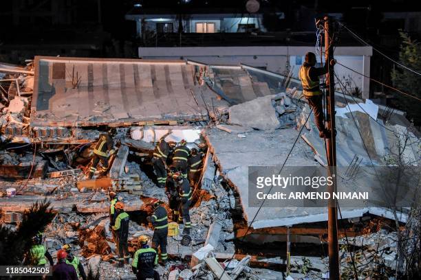 Italian search and rescue team search for six members of Lala family stuck under the rubble of a collapsed building in the town of Durres on November...