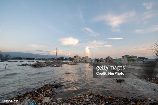 Motorbike riders will break the tidal flood in Kampung Lere, Palu, Central Sulawesi, Indonesia, on November 27, 2019. The high tide caused residents'...