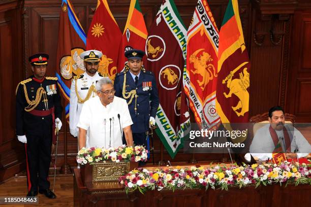 Sri Lanka's president Gotabaya Rajapaksa speaks as his brother, prime minister, Mahinda Rajapaksa looks on at a ministerial swearing-in ceremony at...