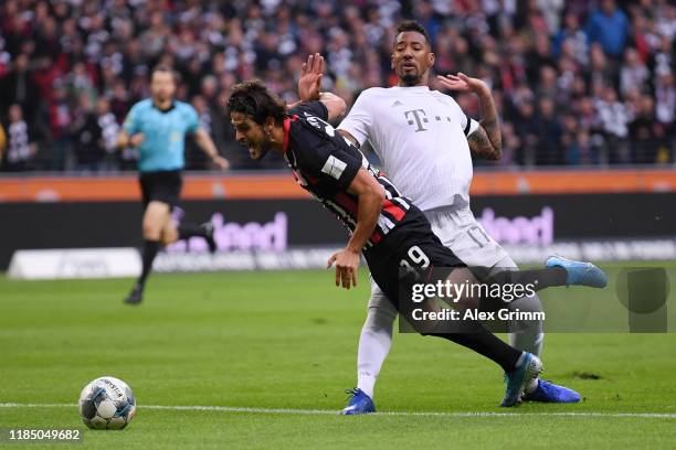 Jerome Boateng of FC Bayern Munich tackles Goncalo Paciencia of Eintracht Frankfurt which leads to a red card for Jerome Boateng during the...