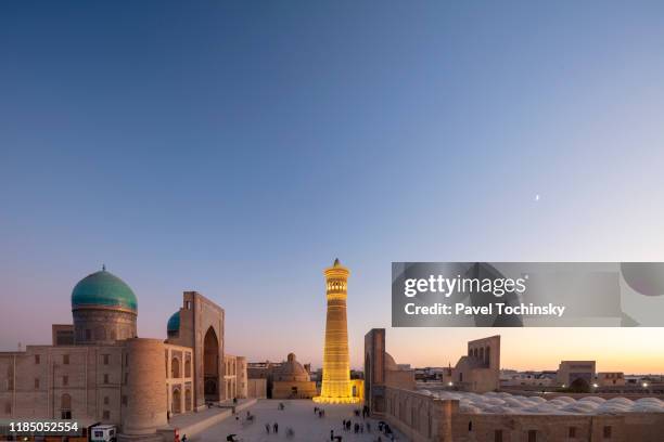 16th century miri-arab madrasah and kalyan minaret built by the qarakhanid ruler mohammad arslan khan in 1127, bukhara, uzbekistan - gateway high school stock pictures, royalty-free photos & images