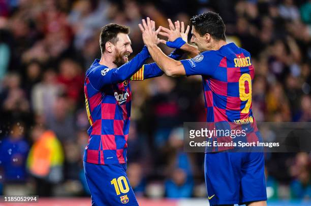 Lionel Messi of FC Barcelona celebrates his goal with Luis Suarez of FC Barcelona teammates during the UEFA Champions League group F match between FC...