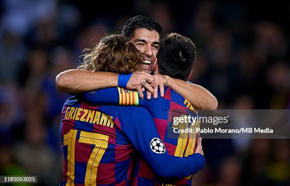Lionel Messi of Barcelona celebrates with his teammates after scoring