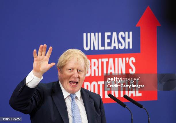 Prime Minister and Conservative Party leader, Boris Johnson delivers a speech to an audience as he visits Healey's Cornish Cyder Farm on November 27,...