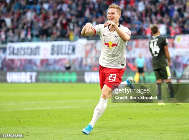 Marcel Halstenberg of RB Leipzig celebrates after scoring his team's fourth goal during the Bundesliga match between RB Leipzig and 1. FSV Mainz 05...