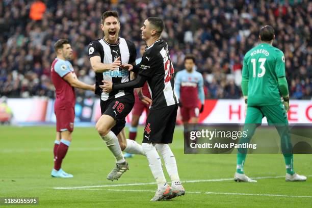 Federico Fernandez of Newcastle United celebrates with teammate Miguel Almiron after scoring his team's second goal during the Premier League match...