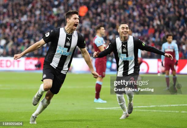 Federico Fernandez of Newcastle United celebrates with teammate Miguel Almiron after scoring his team's second goal during the Premier League match...