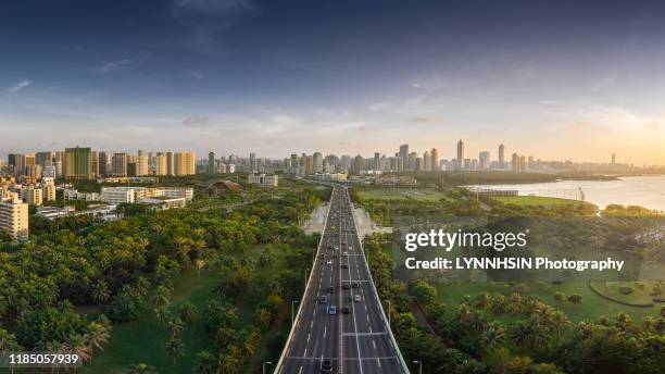 welcome to haikou - green road imagens e fotografias de stock