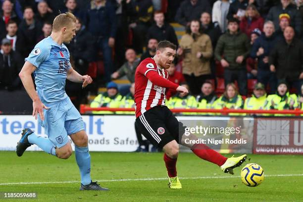 John Fleck of Sheffield United scores his team's third goal during the Premier League match between Sheffield United and Burnley FC at Bramall Lane...