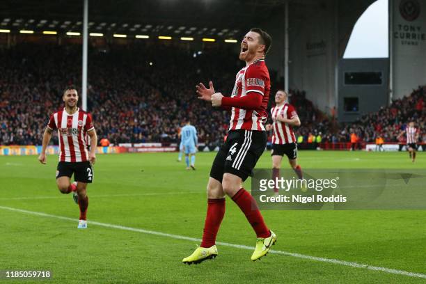John Fleck of Sheffield United celebrates after scoring his team's third goal during the Premier League match between Sheffield United and Burnley FC...