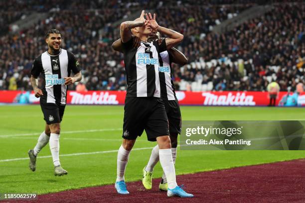 Jonjo Shelvey of Newcastle United celebrates after scoring his team's third goal during the Premier League match between West Ham United and...