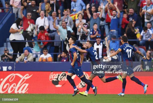 Nemanja Radoja of Levante UD celebrates with teammates after scoring his team's third goal during the Liga match between Levante UD and FC Barcelona...