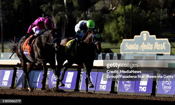 Jockey Flavien Prat riding Storm the Court wins the TVG Juvenile Grade 1 race during the Breeders Cup World Championships horse racing at Santa Anita...