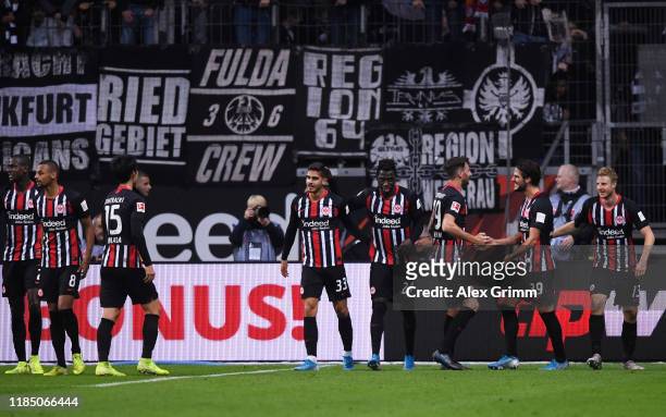 Goncalo Paciencia of Eintracht Frankfurt celebrates with teammates after scoring his team's fifth goal during the Bundesliga match between Eintracht...