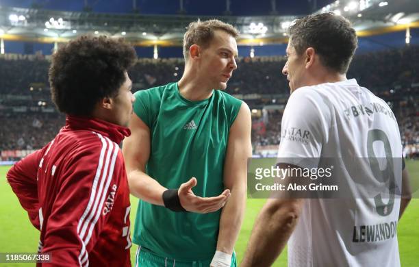 Serge Gnabry, Manuel Neuer and Robert Lewandowski of FC Bayern Munich talk after the Bundesliga match between Eintracht Frankfurt and FC Bayern...