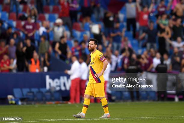 Lionel Messi of FC Barcelona reacts after Levante UD's third goal during the Liga match between Levante UD and FC Barcelona at Ciutat de Valencia on...