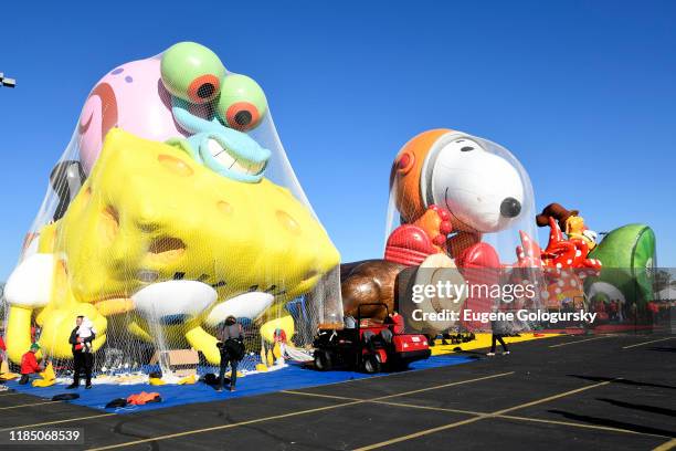 The balloons are seen being inflated as Macy's unveils new balloons for the 93rd annual Macy's Thanksgiving Day Parade at MetLife Stadium on November...