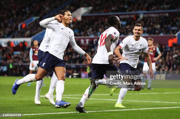 Sadio Mane of Liverpool celebrates with teammates after scoring his team's second goal during the Premier League match between Aston Villa and...