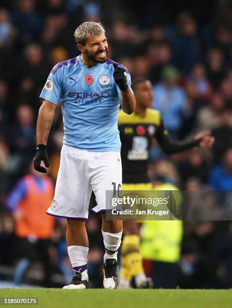 Sergio Aguero of Manchester City celebrates after scoring his team's first goal during the Premier League match between Manchester City and...