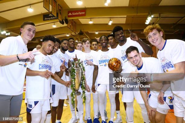 The Kansas Jayhawks pose for a photo with the championship trophy after winning the 2019 Maui Invitational at the Lahaina Civic Center on November...