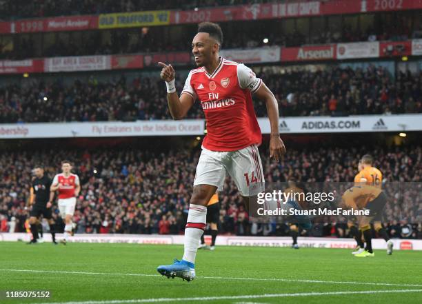 Pierre-Emerick Aubameyang celebrates scoring the Arsenal goal during the Premier League match between Arsenal FC and Wolverhampton Wanderers at...