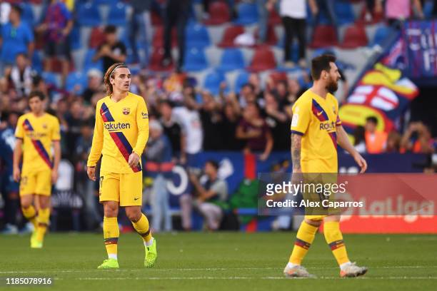 Antoine Griezmann and Lionel Messi of FC Barcelona react during the Liga match between Levante UD and FC Barcelona at Ciutat de Valencia on November...